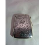 A 1921 silver cigarette case. Front cartouche engraved with "MVD". Birmingham, WH Haseler Ltd.