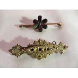 An 1896 9ct gold mourning brooch with seed pearls (2x missing) (3g), and dark stones and one other