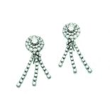 A pair of diamond earrings of circular design