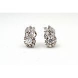 A pair of diamond earrings, with central brilliant-cut diamond with brilliant-cut and marquise-shape