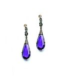 A pair of amethyst and white sapphire earrings.