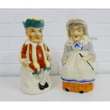 Punch and Judy Staffordshire pottery Toby jugs (2), 26cm high