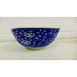 A Chinese blue and white prunus bowl bearing four character Kangxi marks to base, 23cm diameter