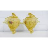 A pair of Royal Worcester blush ivory wall pockets painted with floral sprays bearing green back