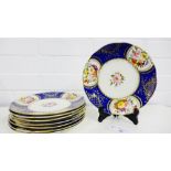 A group of eight 19th century plates hand painted with floral sprays with cobalt blue and gilt