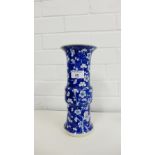 A Chinese blue and white prunus Gu shaped vase, bearing six character Kangxi marks to the base,