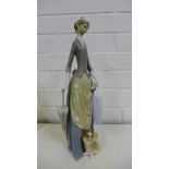 Lladro porcelain figure of a Lady with her Parasol and Dog at her feet, 37cm high