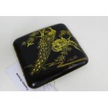 A Japanese Komai black lacquered cigarette case with coloured inlaid metals depicting Peacocks and