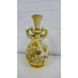 A Royal Worcester blush ivory two handled vase decorated with flowers and foliage, shape No.1327,