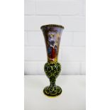 A 19th century Limoges enamel vase of flared baluster form, decorated with a lady dressed in 18th