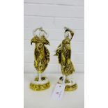 A pair of Classical porcelain female figures, each modelled standing in a dancing pose wearing a