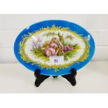 A Serves style porcelain oval plaque, painted with a Shepherd and companion scene to centre