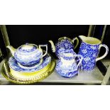 A collection of blue and white pottery to include a Spode's Italian pattern jug, a prunus pattern