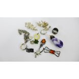 A mixed lot to include a silver bracelet with heart padlock, two Sterling silver cherub brooches, an