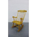 A pine spindle back rocking chair