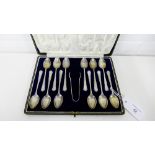 George V cased set of twelve silver teaspoons and sugar tongs with makers marks for William Hutton &