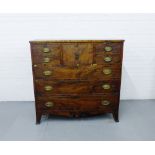 A 19th century mahogany Scotch chest the rectangular top over a central hat drawer flanked by two