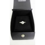 An 18 carat white gold and diamond solitaire ring, UK ring size P