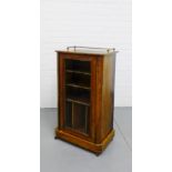 A 19th century rosewood and inlaid music cabinet, the rectangular top with a brass gallery over a