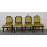 A set of four mahogany framed side chairs with upholstered backs and seats on turned supports and