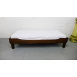 A stained wood day bed, 200cm x 80cm