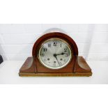 A mahogany case Napoleon's Hat mantle clock the silvered dial with Arabic numerals, 39 x 25cm