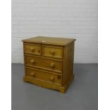 A pine bedside with two short and two long drawers, 60cm x 62cm