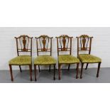 A set of four rosewood and inlaid side chairs, the shaped top rail with mask head inlay over a