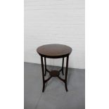 An Edwardian inlaid circular side table on tapering supports with an undertier, 76cm x 60cm