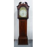 A 19th century stained country wood longcase clock with a broken swan neck pediment over a painted