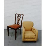 An upholstered child's easy chair on bun feet together with a Chippendale style splat back chair (