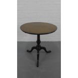 A mahogany tea table the circular top on tripod supports, 74cm x 76cm