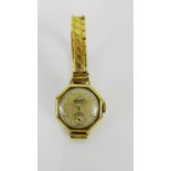 Lady's 9 carat gold cased vintage Accurist wristwatch, the champagne dial with Arabic numerals and a