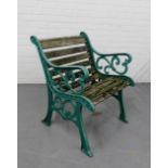 A green painted cast iron and wooden slatted garden chair