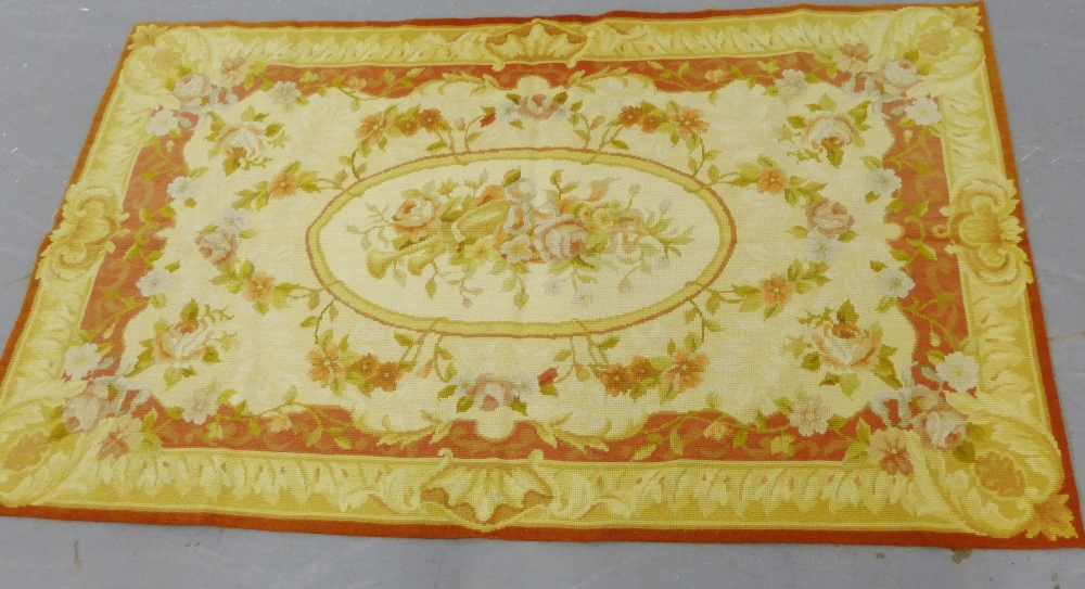 A floral tapestry mat, 150 x 90cm