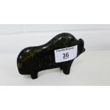 An Inuit carving of a Buffalo, signed Arlook, 12cm long