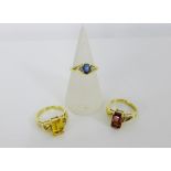 A 9ct gold star sapphire dress ring together with two 9ct gold gemset dress rings (3)