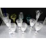 A set of six fruit and vine etched drinking glasses together with three coloured German Hock