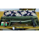 A gun case containing a quantity of gun cleaning equipment and brushes etc.