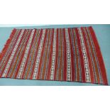 A flat weave Kilim, the ground with cream pattern stripes, 220 x 150cm