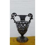 A patinated metal twin handled garden urn, 68cm high