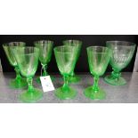 A collection of Uranium glass to include six wine glasses and one larger (7)