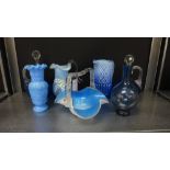 A collection of 19th century and later blue glass to include a posy basket, a pair of decanters