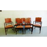 A set of seven mahogany framed dining chairs with upholstered backs and slip in seats on block