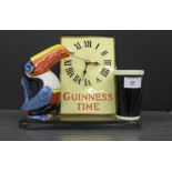 A Guinness time clock surmounted by a toucan and a pint of Guinness, 26 x 22cm