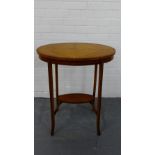 An Edwardian satinwood quarter veneered side table, the oval top on splayed supports with an