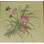 A needlework on silk panel depicting flowers and a butterfly, in a glazed frame, 45 x 42cm