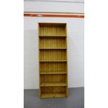 A pine open bookcase of large proportions, 228 x 87cm