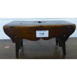 A stained country wood miniature apprentice style table on trestle supports, 23 x 12cm