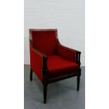 A mahogany and inlaid armchair with upholstered back, sides and seat on fluted and turned